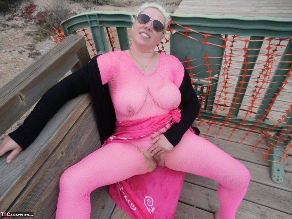 Aged lady Barby looses her big tits from a crotchless bodystocking by the sea - #6