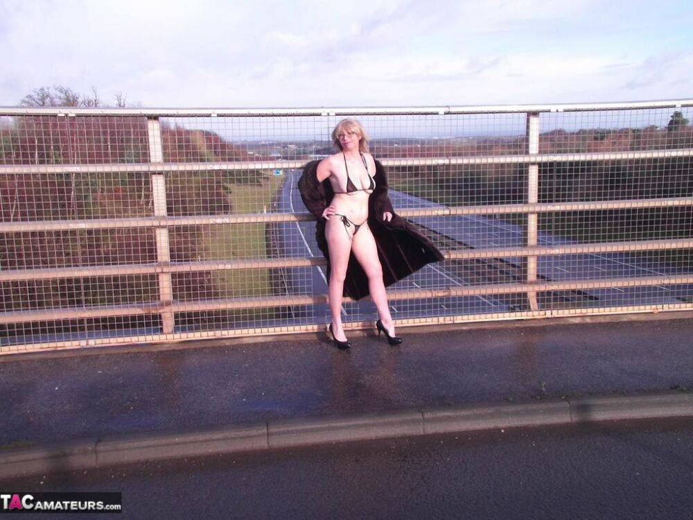 Older amateur Barby Slut flashes on a sidewalk upon an overpass - #7