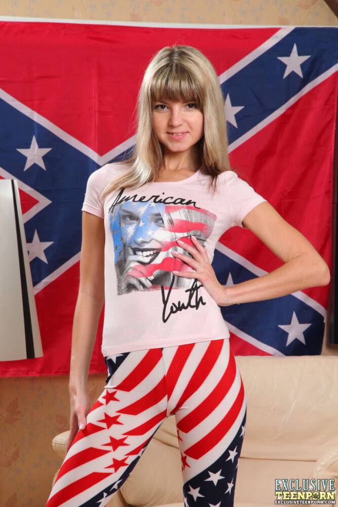 Young looking girl Molly masturbates with the Confederate Flag hung on a wall - #11