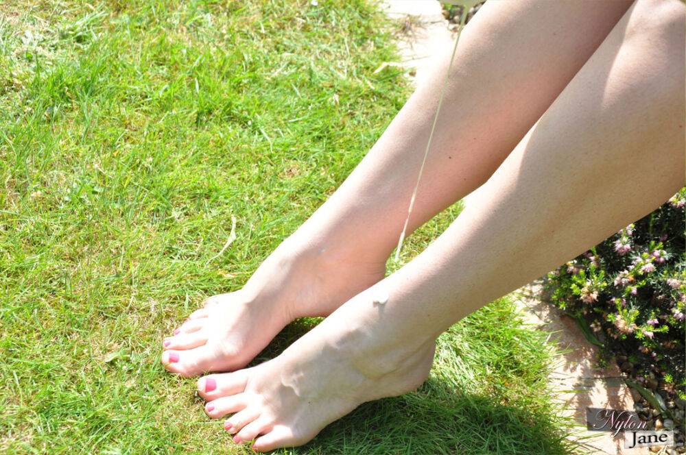 British woman Piage Turnah licks and sucks her own toes on the lawn - #10