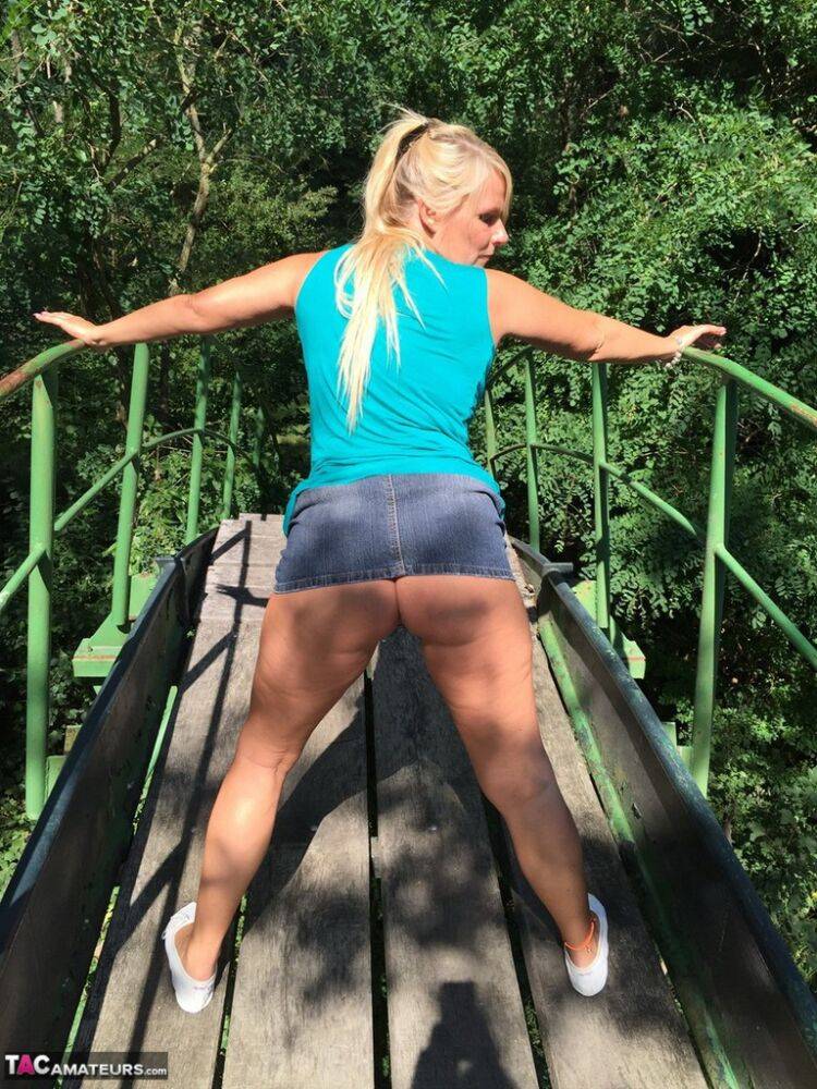 Blonde amateur Sweet Susi lifts her dress over her ass on outdoors stairs - #10