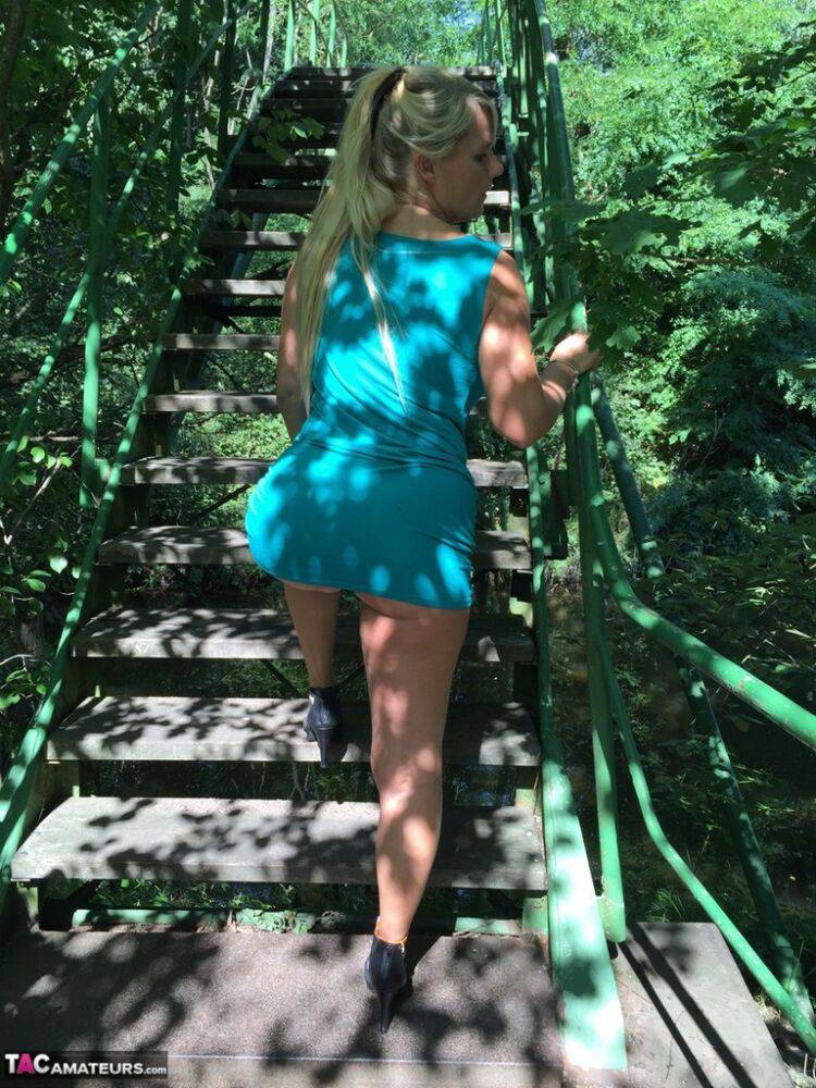 Blonde amateur Sweet Susi lifts her dress over her ass on outdoors stairs - #4