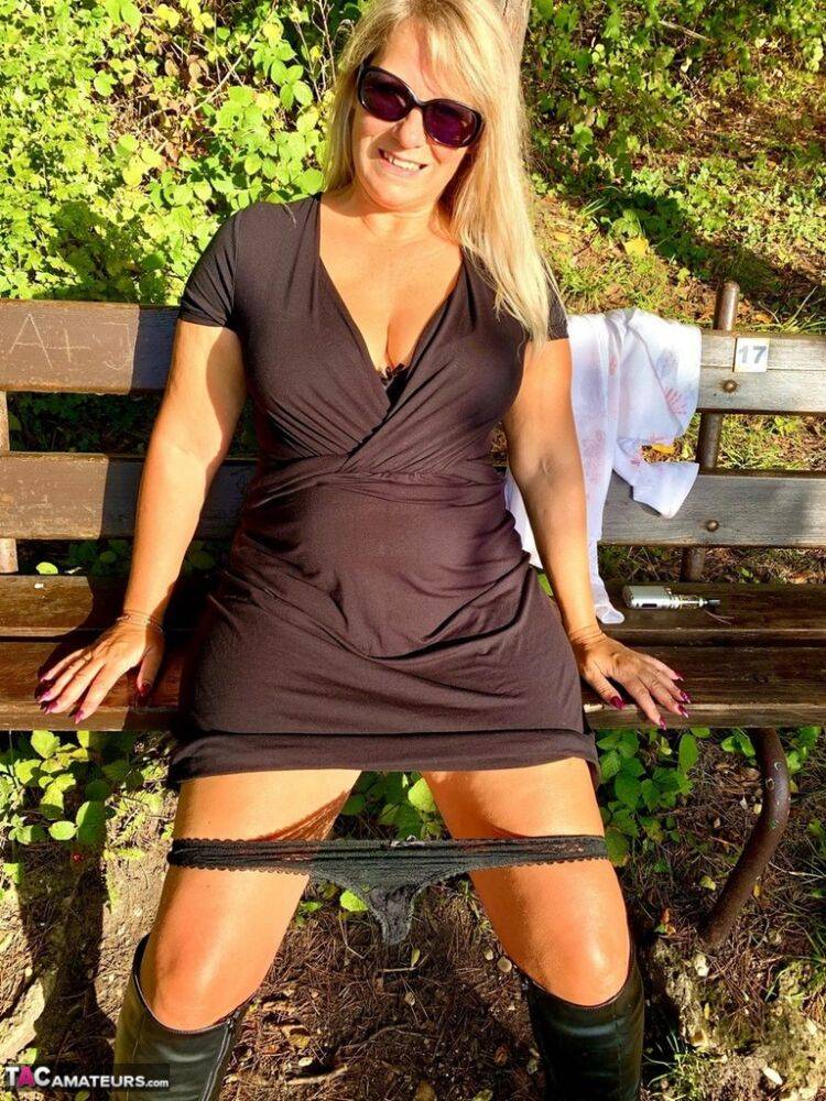 Older blonde Sweet Susi hikes up a black dress to expose her snatch in nature - #12