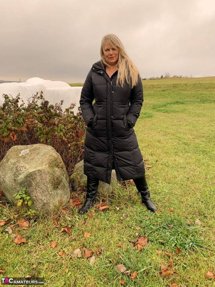 Older blonde Sweet Susi exposes herself in a field while wearing a winter coat - #10