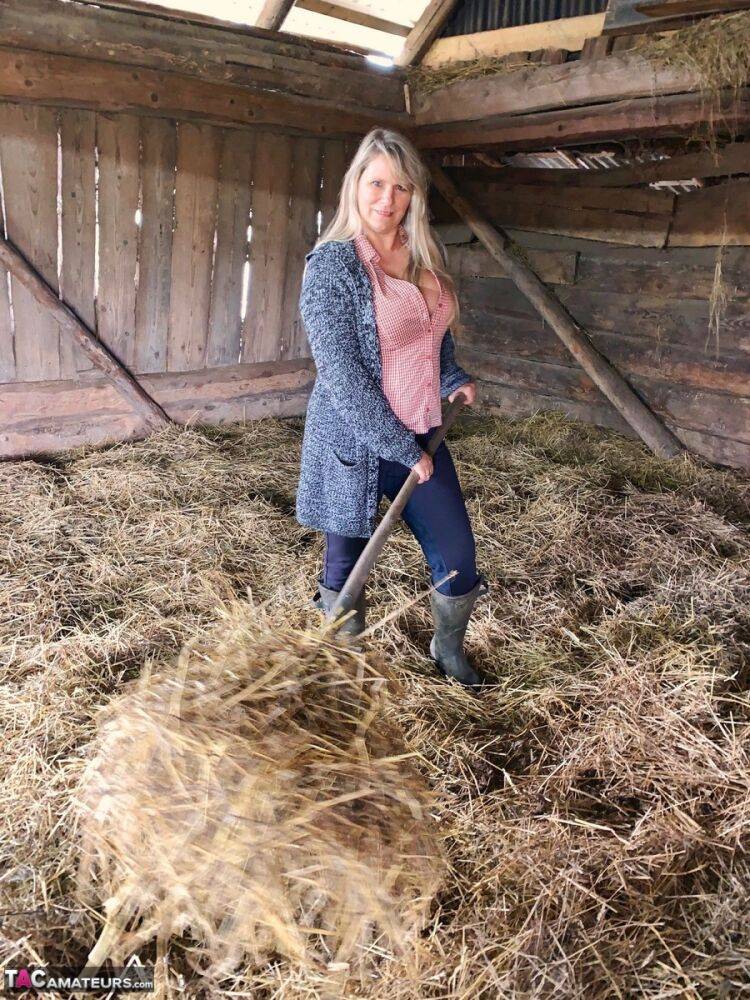 Overweight amateur Sweet Susi strips naked while forking hay in a mow - #15