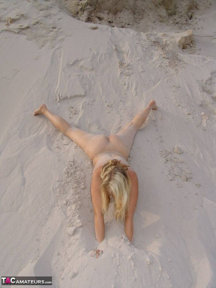 Blonde amateur Sweet Susi gets totally naked on a sandy bank by herself - #5