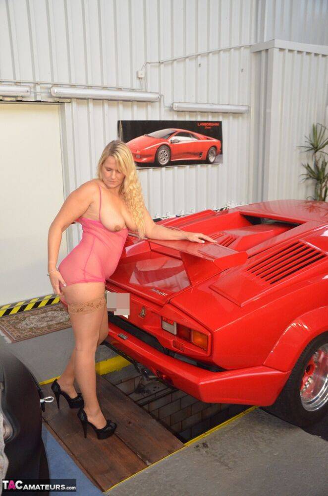 German MILF Sweet Susi exposes her tits in front of a Lamborghini | Photo: 1330368