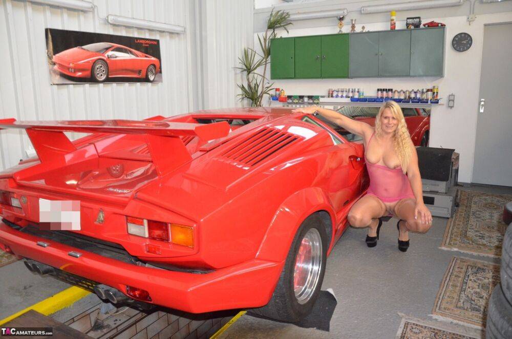 German MILF Sweet Susi exposes her tits in front of a Lamborghini | Photo: 1330361