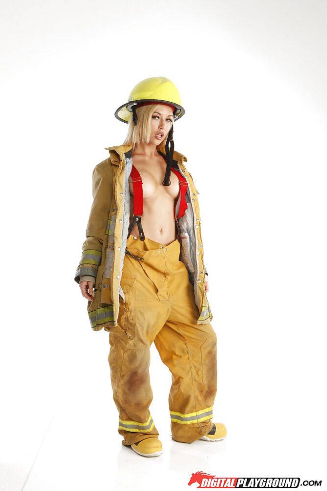 Skinny blonde babe is revealing her tremendous body in a fireman uniform - #5