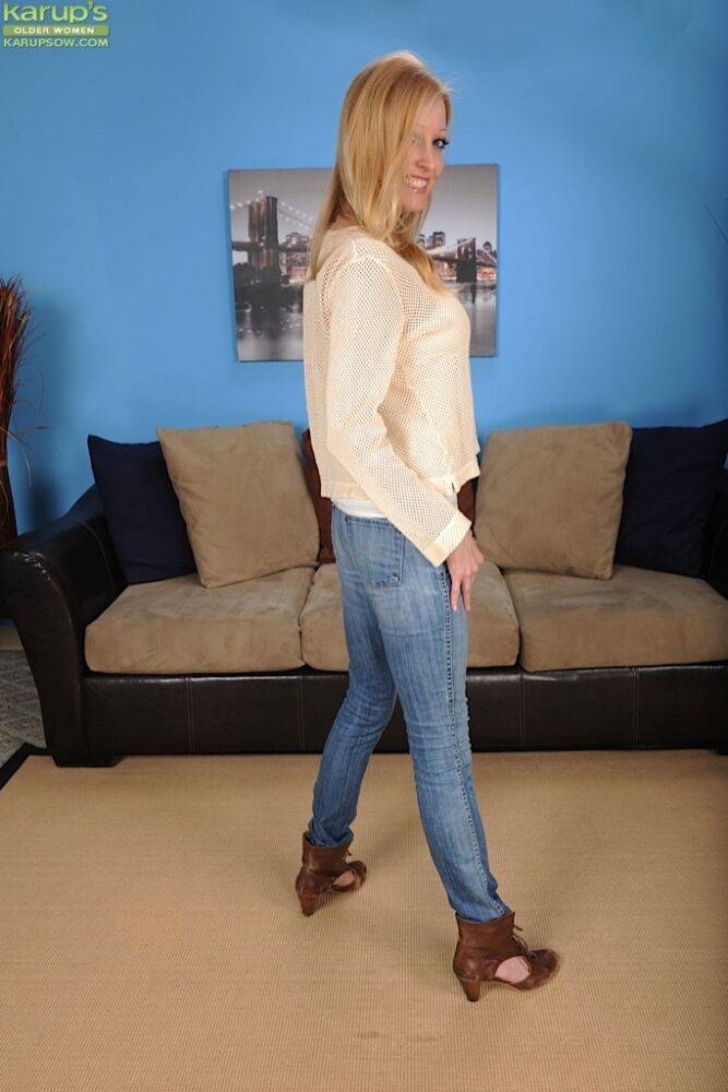 Blonde babe Elle Kenelle revealing big MILF tits in denim blue jeans - #2