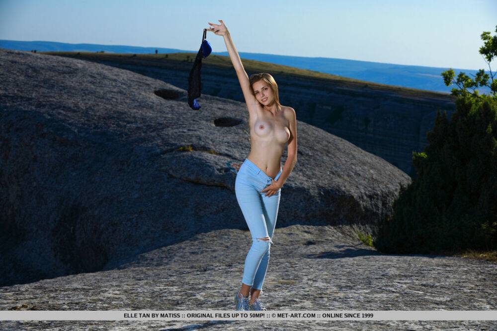 Tall teen Elle Tan casts aside her clothing for great nude poses up on a cliff - #11