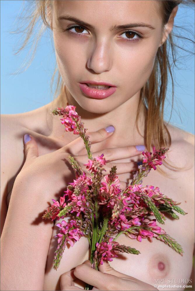 Skinny teen girl spreading naked pussy in a field while picking flowers - #12