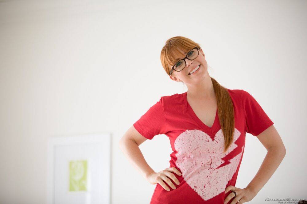 Redhead chick exposes her big natural tits wearing nerdy looking glasses - #10