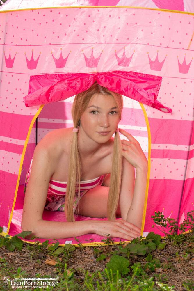Young looking blonde showcases her tight slit inside her princess tent - #16