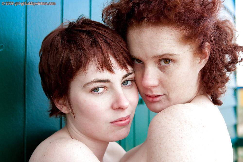 Redhead teens Maria S and Tricia L licking nipples and hairy cunts outdoors - #16