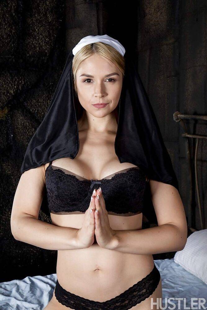 Blonde babe Sara Sloane strips off nun's uniform to expose big tits - #2