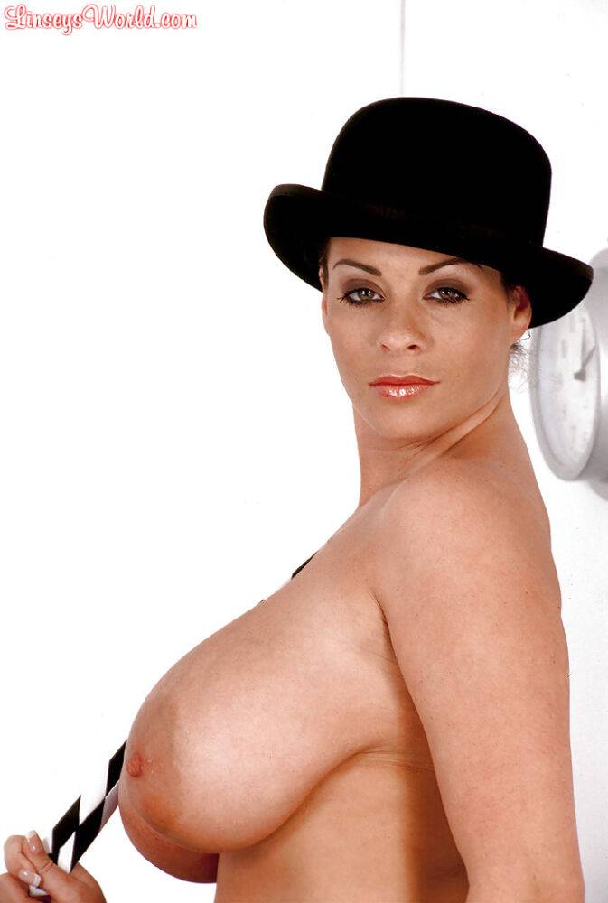 MILF solo girl Linsey Dawn McKenzie posing in hat while exposing huge juggs - #2