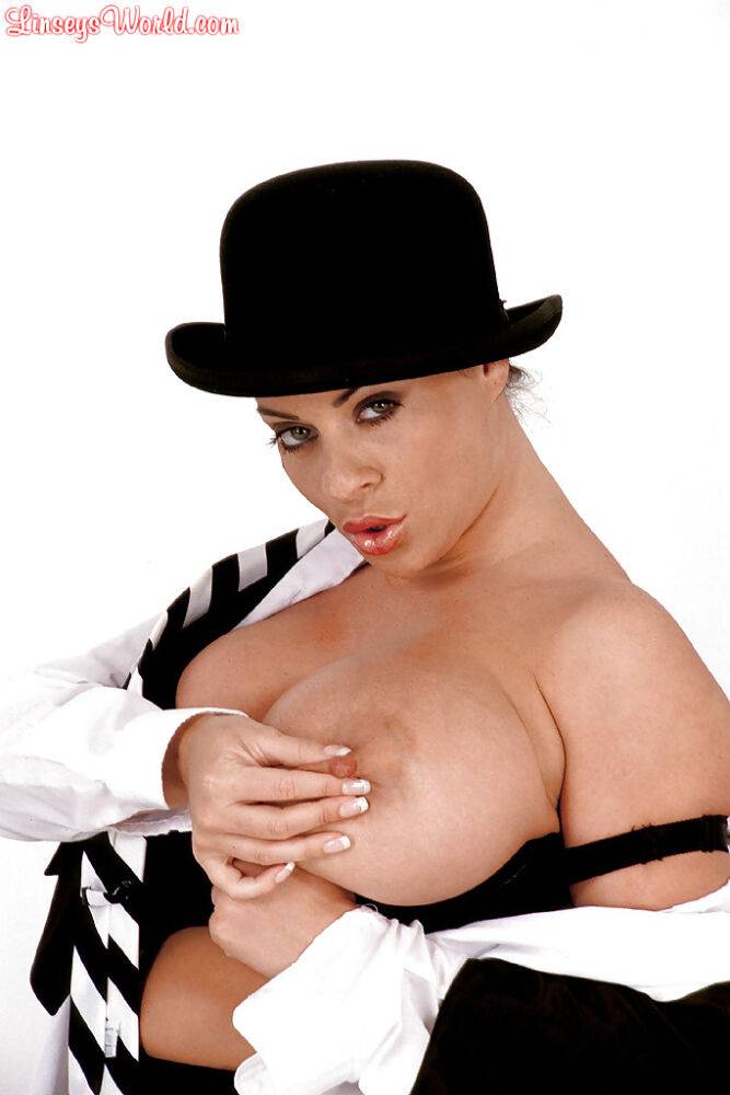 MILF solo girl Linsey Dawn McKenzie posing in hat while exposing huge juggs - #13