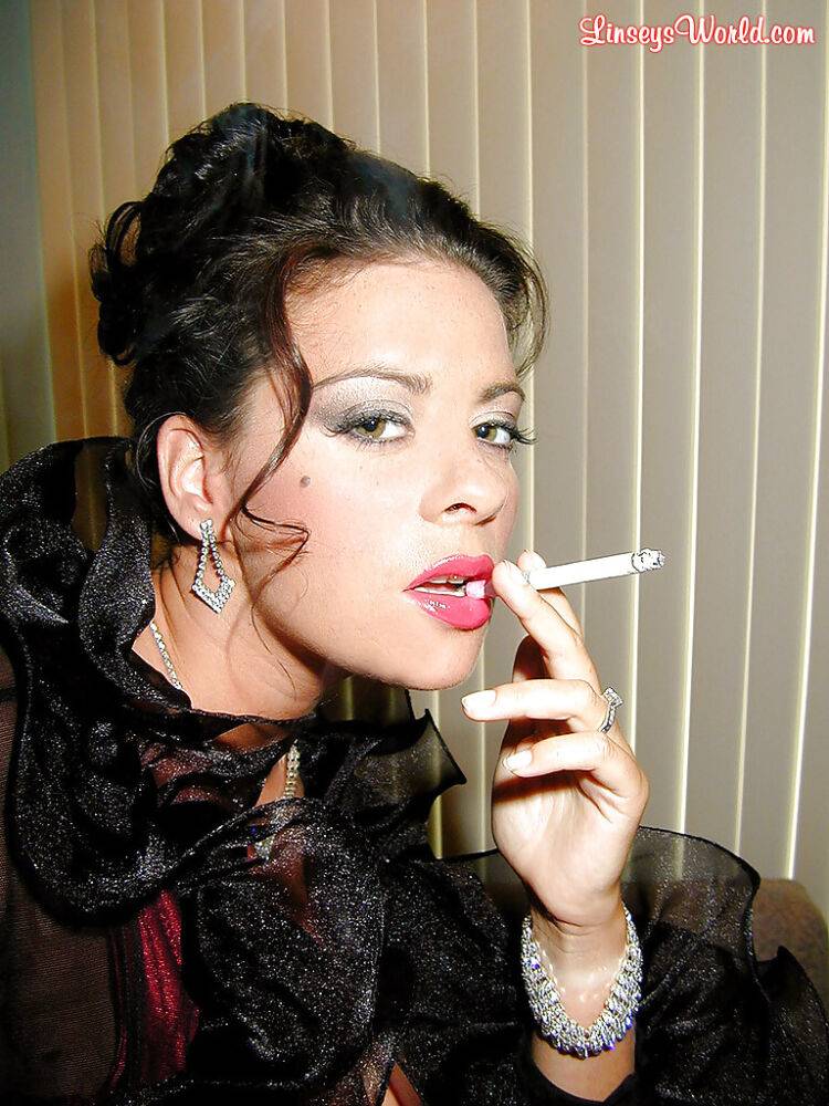 Busty stocking and lingerie clad MILF Linsey Dawn McKenzie having a smoke - #9