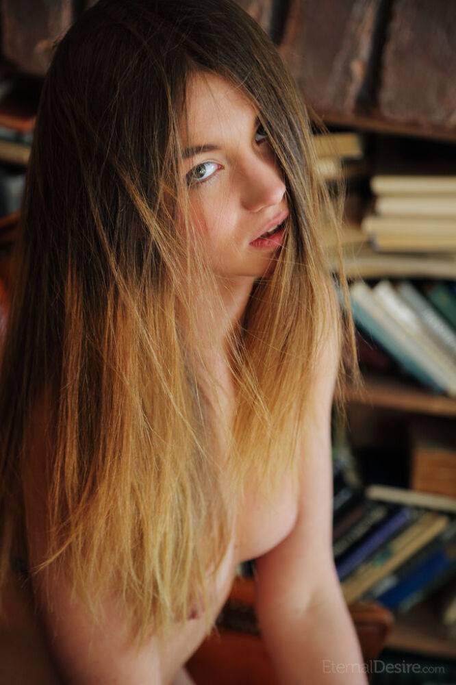 Slender teen Solveig shows the pink of her twat while reading a book - #2