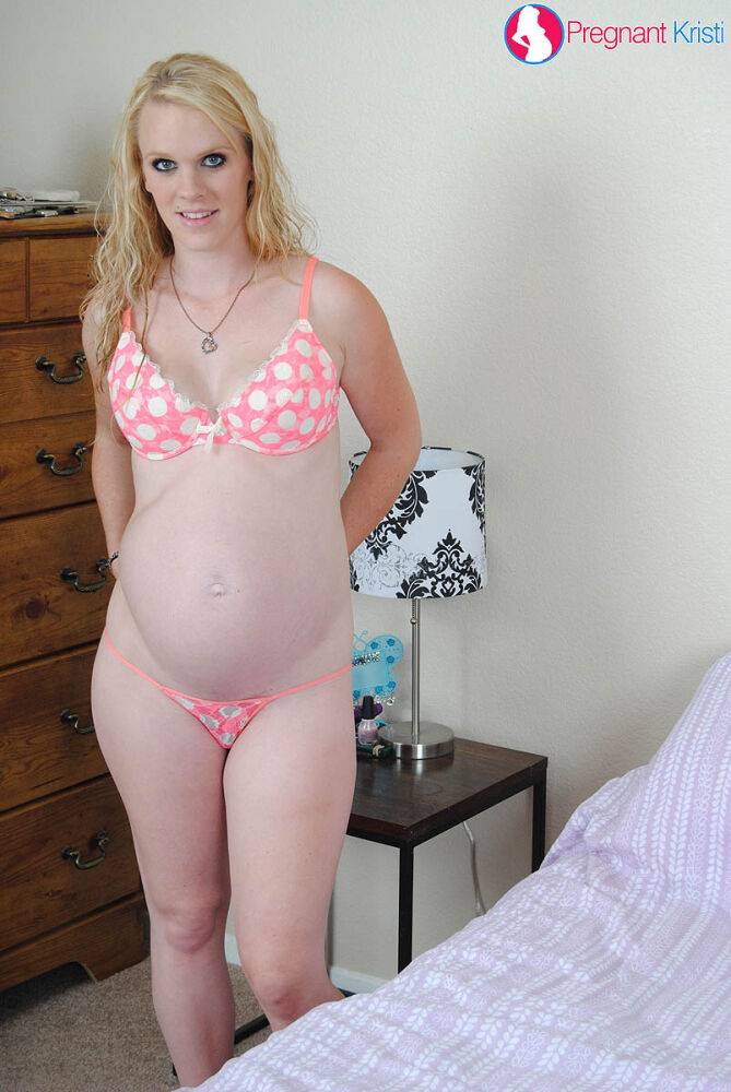 Pregnant amateur Kristi shows the pink of her pussy atop her bed - #10