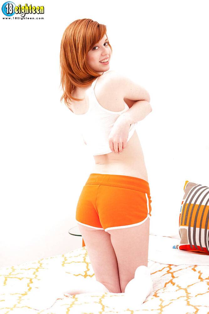 Natural redhead teen Nikki taking off terrycloth shorts to play with pink twat - #2