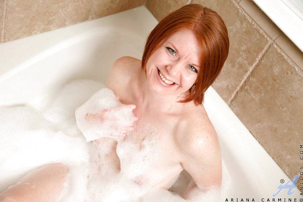 Older lady with red hair Ariana displaying pink cunt lips in bathtub - #11
