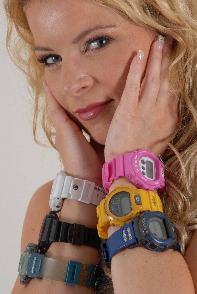 Blonde amateur Sandy models six G-Shocks while wearing ripped jeans - #10