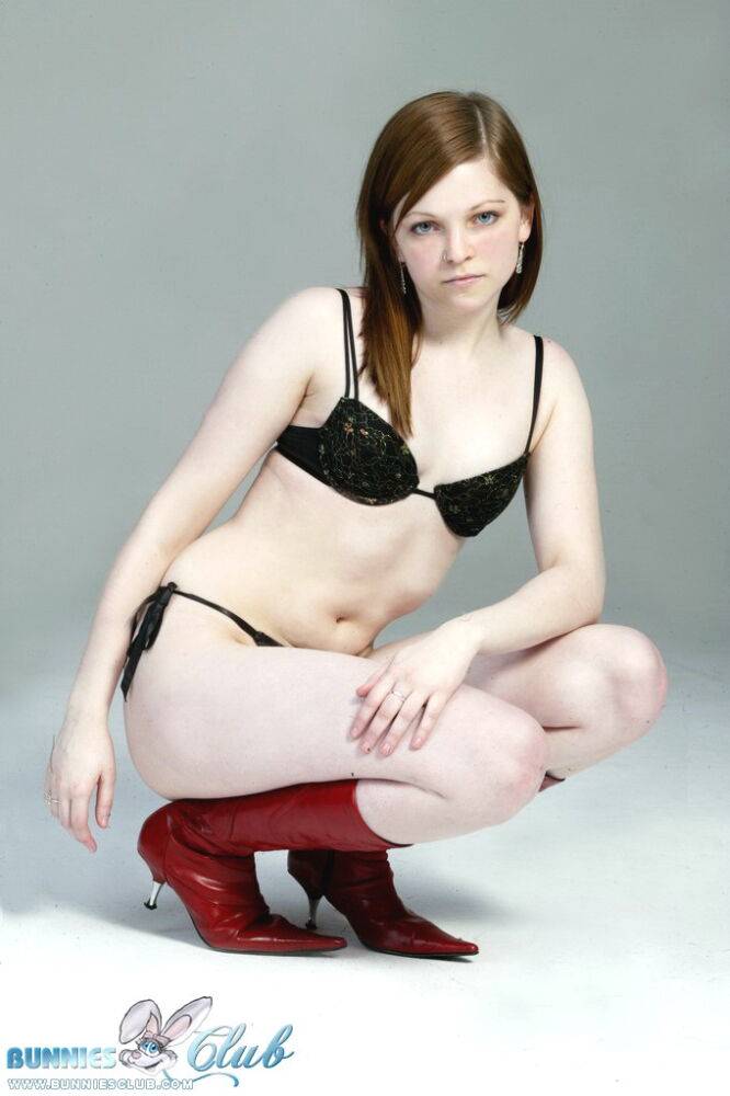 Pale redhead Lilly slowly strips to a black G-string and red leather boots - #15