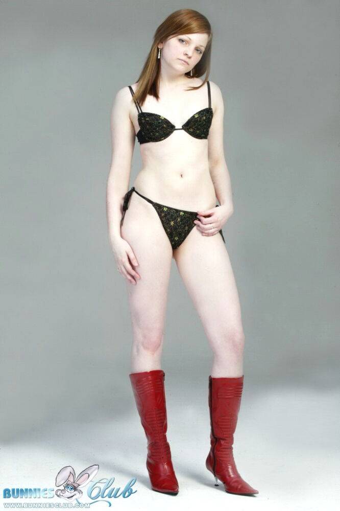 Pale redhead Lilly slowly strips to a black G-string and red leather boots - #8