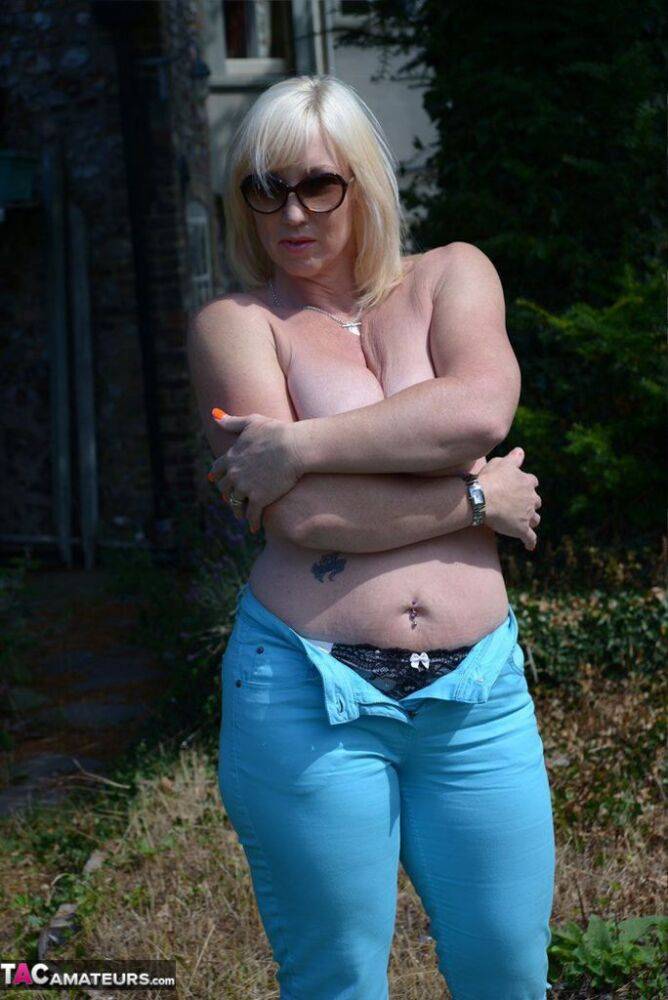 Mature BBW Melody feels the sun's rays on her large tits in the backyard - #12