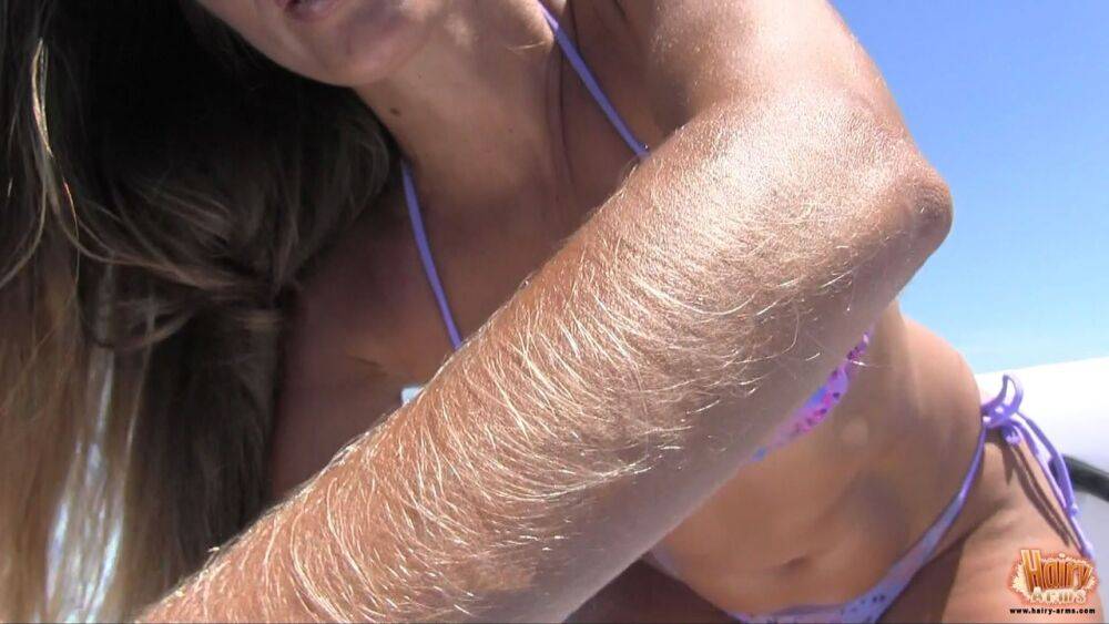 Amateur chick Lori Anderson tugs on her hairy arms in a bikini and shades - #3