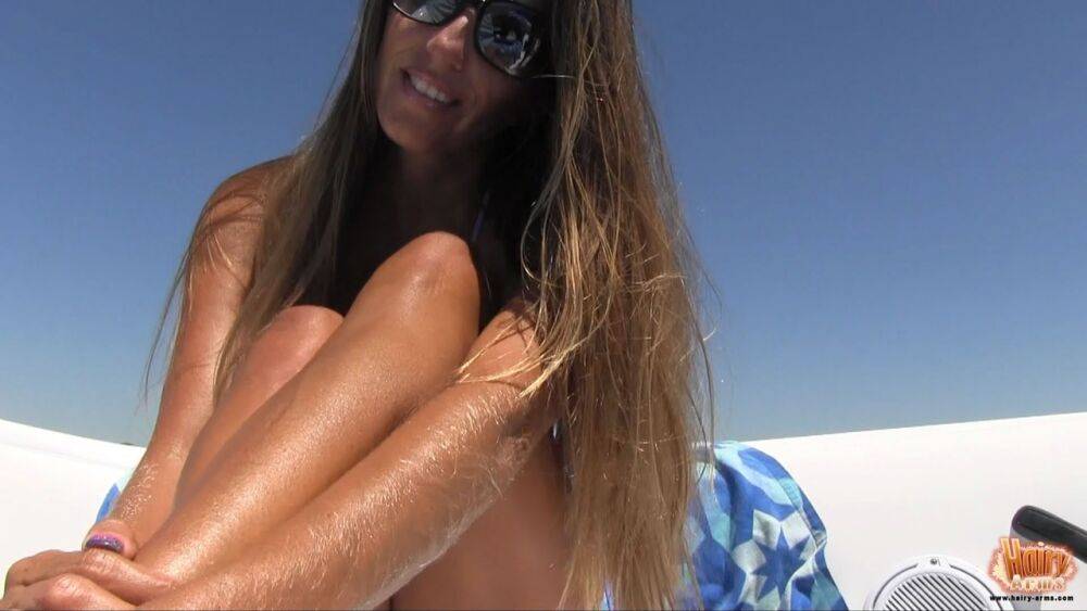 Amateur chick Lori Anderson tugs on her hairy arms in a bikini and shades - #4