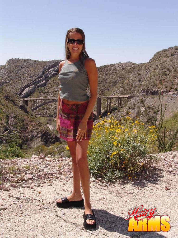 Amateur model Lori Anderson poses high up in the hills in just her sunglasses - #6