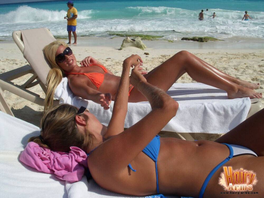 Hirsute blonde Lori Anderson relaxes on a beach in her bikini and sunglasses - #13