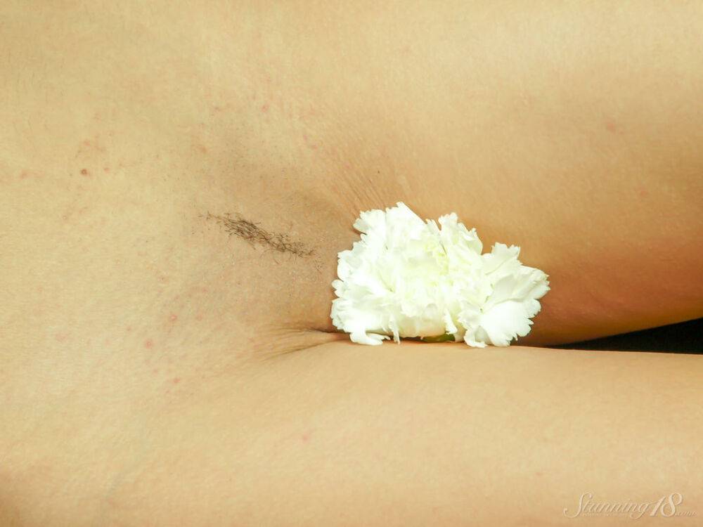 Young model Karena S holds a single flower while posing totally naked - #10