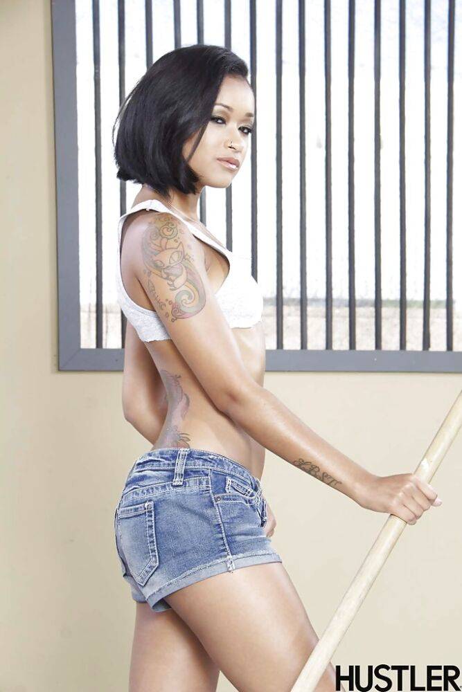 Petite ebony pornstar Skin Diamond posing topless in denim shorts - #1