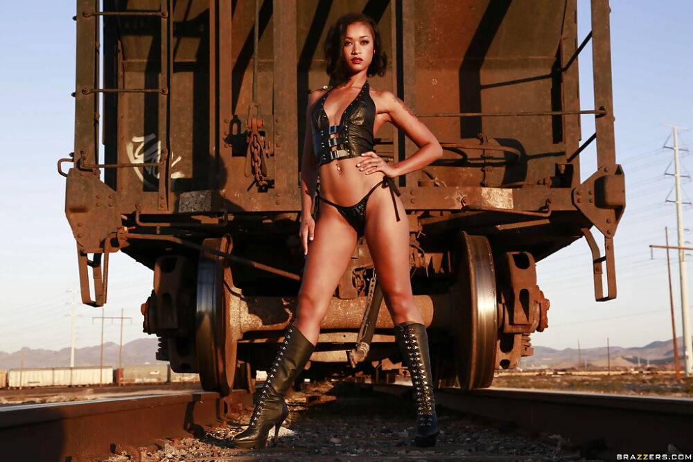 Tattooed babe Skin Diamond poses in her boots outdoor at the train - #10