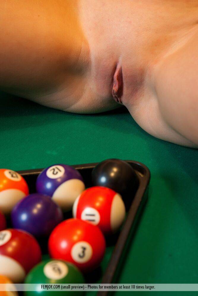 Blonde solo girl Emilia D poses in the nude while shooting pool - #9