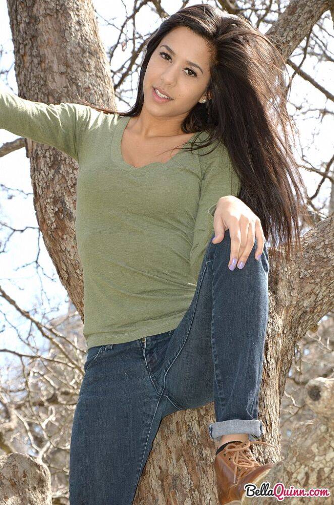 Latina chick Bella Quinn climbs a tree in the park wearing a sweater and jeans - #3