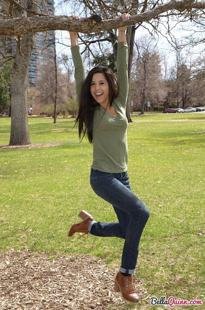Latina chick Bella Quinn climbs a tree in the park wearing a sweater and jeans - #11