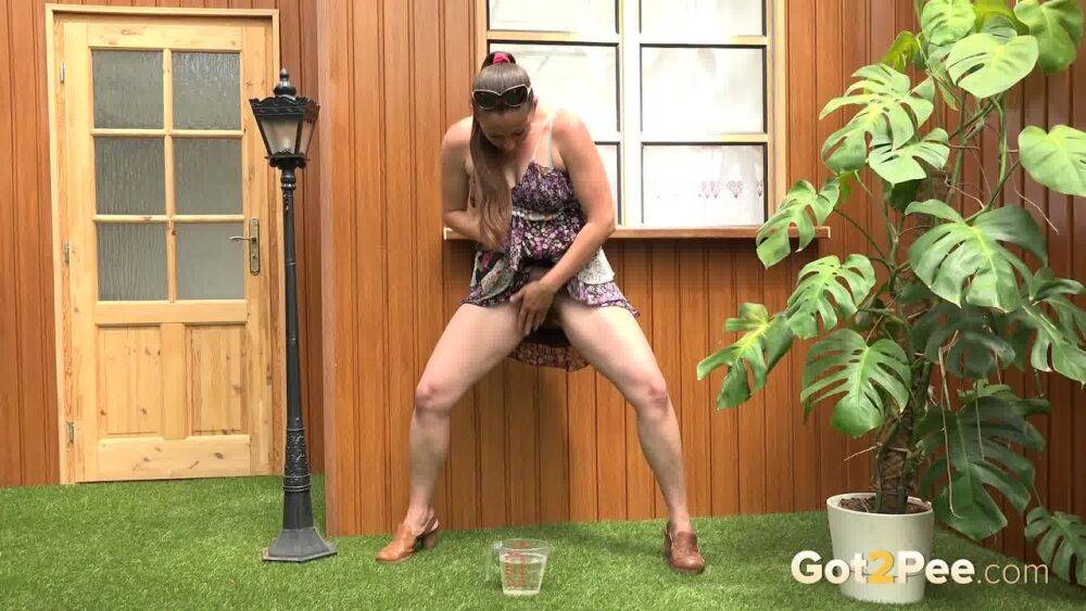 Blonde woman Nicol D hikes short dress to pee standing behind the house - #11