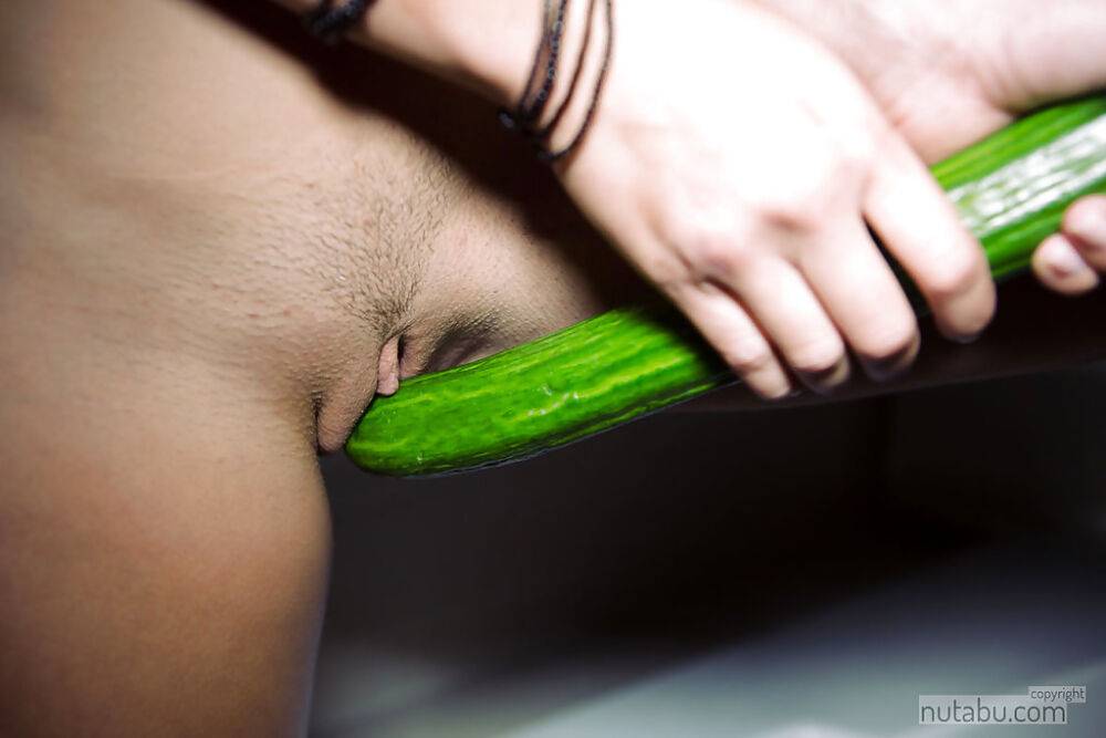 Blonde cutie toys her pleasing teenage pussy with large cucumber - #10