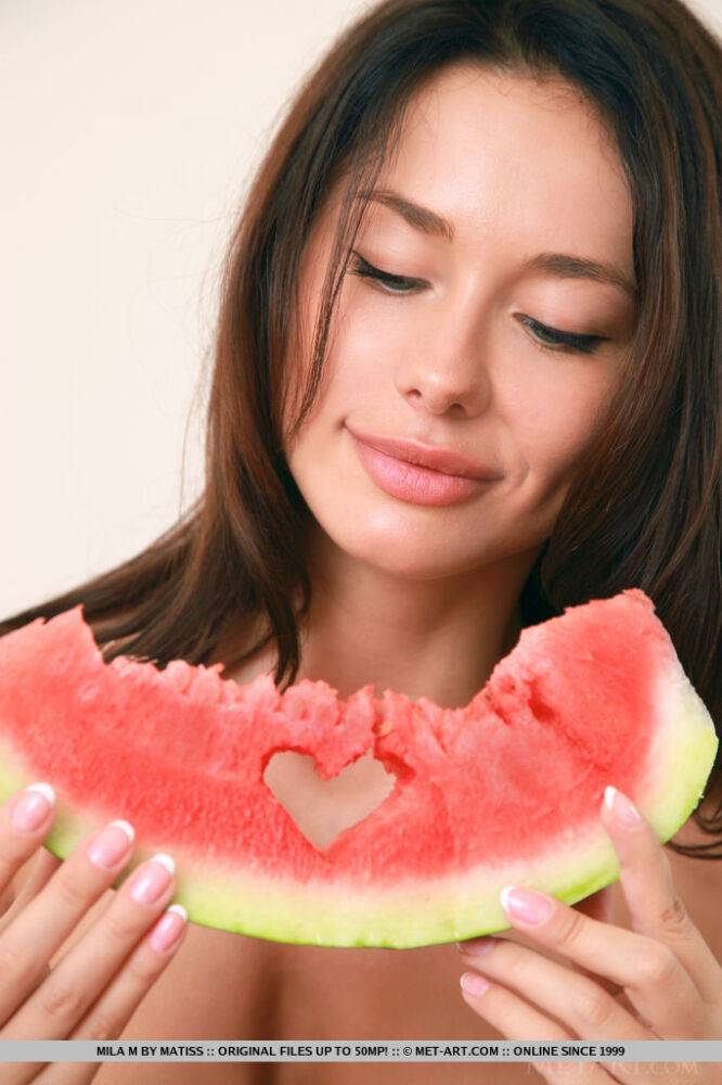 Seductive brunette lass Mila eats a watermelon with her boobs revealed - #4