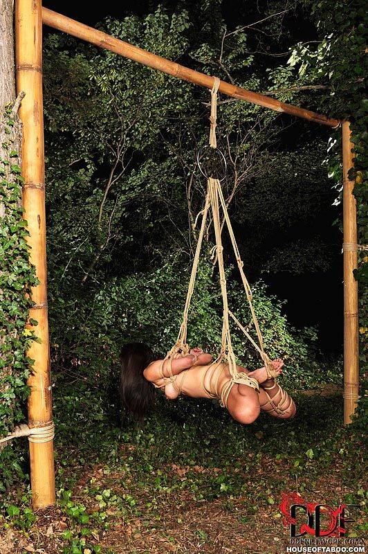 Naked Japanese chick Marica Hase is suspended by rope just outside forest path - #8