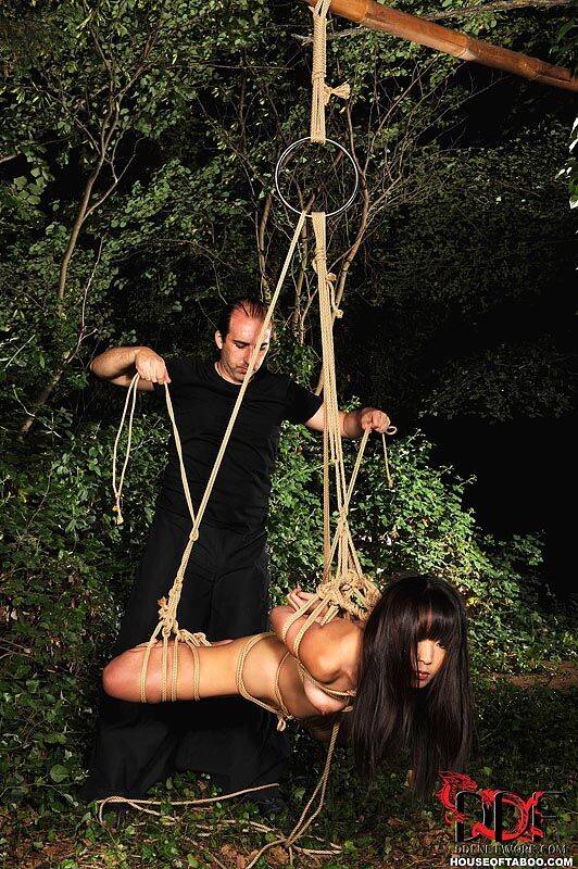 Naked Japanese chick Marica Hase is suspended by rope just outside forest path - #5