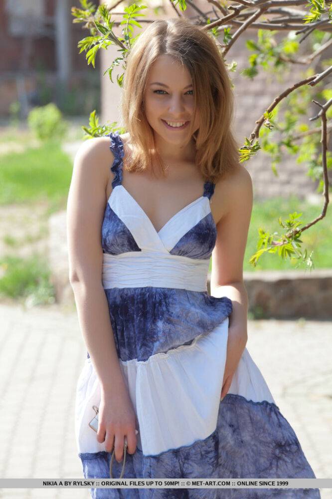 Smiley faced teen Nikia A removing dress for outdoor glamour spread - #10