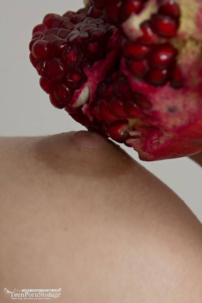 Young first timer Medina holds a pomegranate after fingering her tight slit - #11