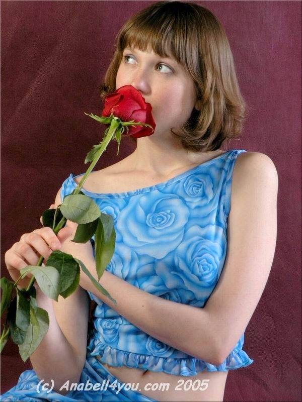 Charming teen Anabell holds a solitary red rose while taking off her clothes - #6