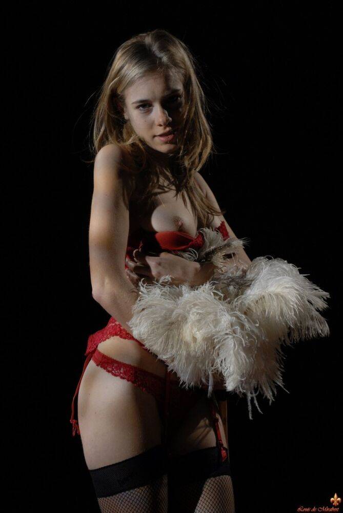 Glamour model Kelly holds a feather duster while removing hot lingerie - #15